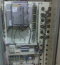 This is electrical panel of the above cnc retrofit of a G & L 445-40 horizontal boring mill.  The Dynapath Delta 2000 is mounted where the old triac board racks were once located. You see to the right of the Dynapath, the inductosyn to digital converters and below the slim line relays interfacing the starters and solenoids and the I/O terminal strips.  The old control cabinet was retired.  The Powerflex DC drive was mounted in the rear cabinet. 